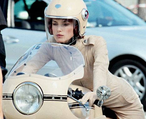 She shot the ad in Paris riding a classic 1970s Ducati Super Sport wearing 