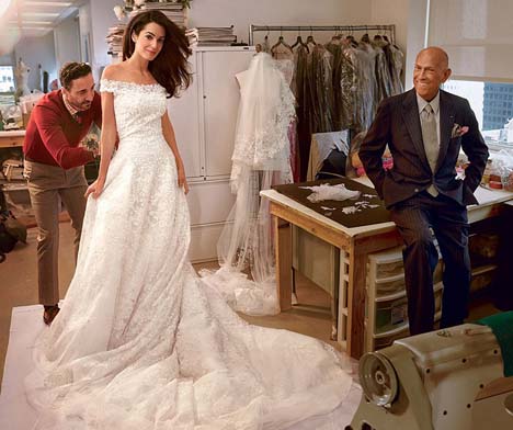 Amal Alamuddin at final fitting with designer Oscar de la Renta